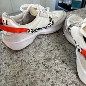 Nike White Sneakers with Black Cow-Print Swoosh & Bright Orange Heel Tab
